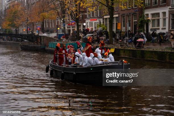 sinterklaas travels by boat in amsterdam - sinterklaas stock pictures, royalty-free photos & images