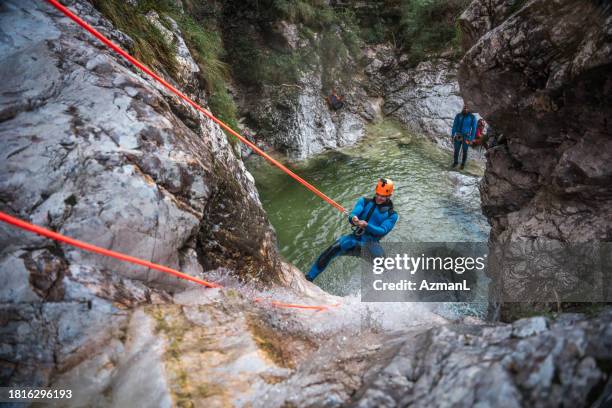 canyoning adventure with caucasian male - water slovenia stock pictures, royalty-free photos & images