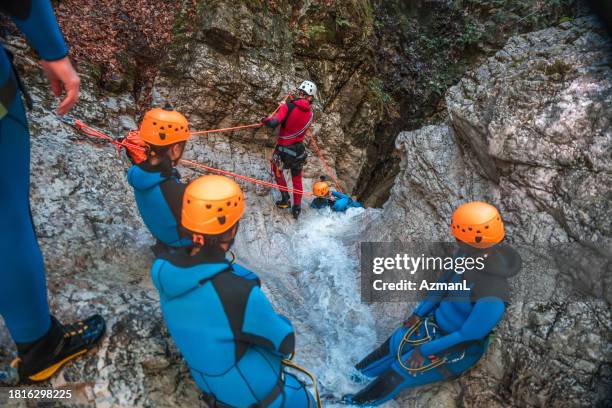 canyoning exploration with diverse participants - slovenia spring stock pictures, royalty-free photos & images