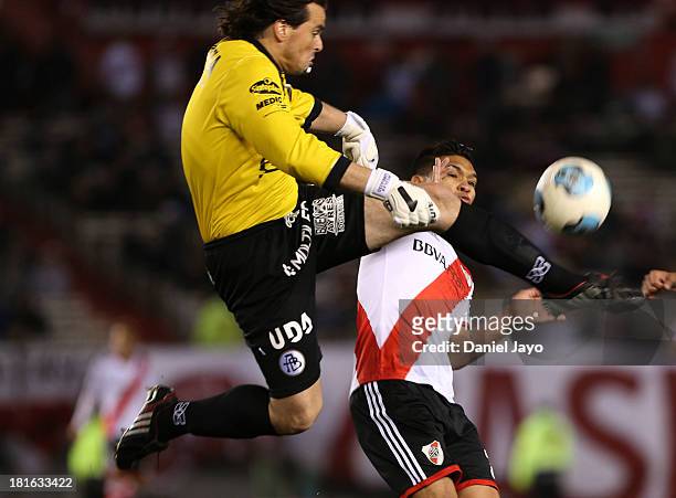 Nicolas Cambiasso, of All Boys, and Teofilo Gutierrez, of River Plate, fight for the ball during a match between River Plate and All Boys as part of...