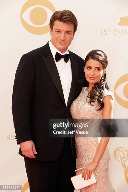 Actor Nathan Fillion and actress Mikaela Hoover arrive at the 65th Annual Primetime Emmy Awards held at Nokia Theatre L.A. Live on September 22, 2013...