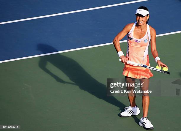 Kimiko Date-Krumm of Japan smiles after winning her women's singles first round match against Anastasia Rodionova of Australia during day two of the...