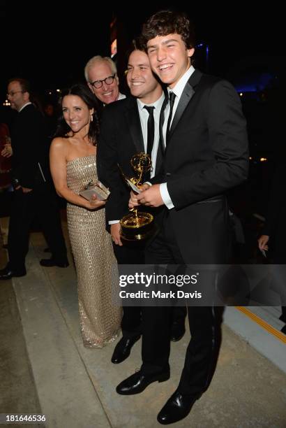 Actress Julia Louis-Dreyfus, husband Brad Hall and sons Charles and Henry attend the Governors Ball during the 65th Annual Primetime Emmy Awards at...