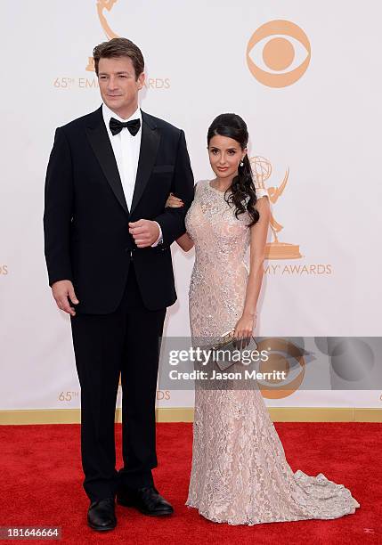 Actor Nathan Fillion and actress Mikaela Hoover arrive at the 65th Annual Primetime Emmy Awards held at Nokia Theatre L.A. Live on September 22, 2013...