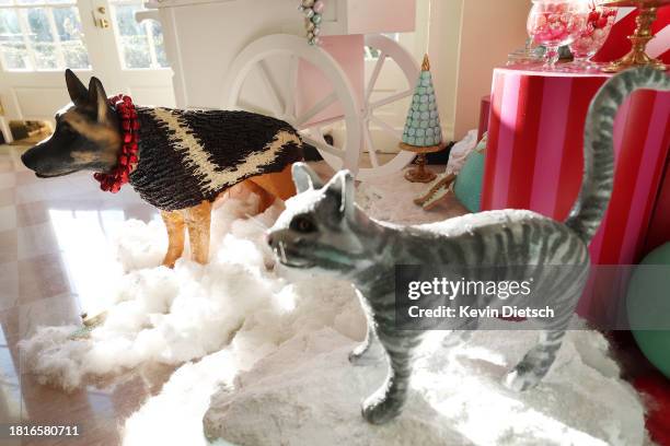 Decorated statues of the First Family's pets, Commander the dog and Willow the cat, are displayed in the East Wing during a media preview of the...