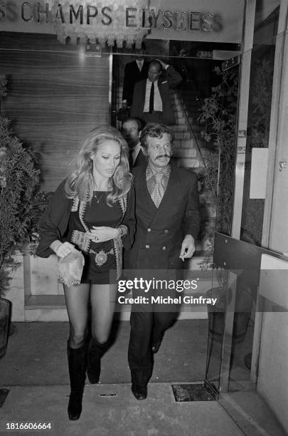 Swiss-American actress Ursula Andress with partner French actor Jean-Paul Belmondo attend the premiere of Soleil Rouge, directed by Terence Young, on...