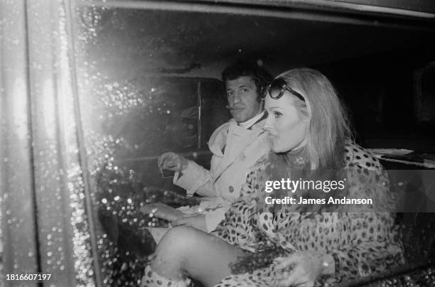 Swiss actress Ursula Andress and her partner French actor Jean-Paul Belmondo attended a boxing match, on 25 March 1968 at the Palais des Sports in...