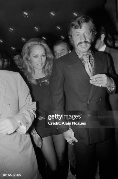 Swiss-American actress Ursula Andress with partner French actor Jean-Paul Belmondo attend the premiere of Soleil Rouge, directed by Terence Young, on...