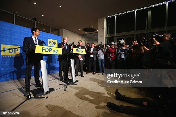 Philipp Roesler , Chairman of the German Free Democrats political party, and FDP lead candidate Rainer Bruederle speak to the media the day after the...