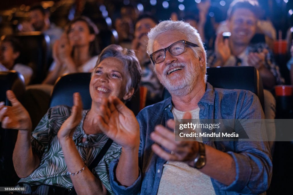 Senior couple having a good time at the movies