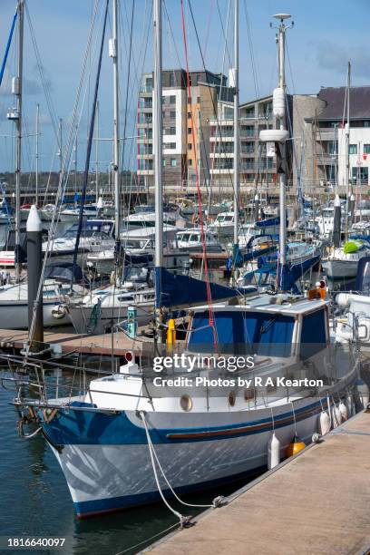 boats moored in caernarfon harbour on the coast of north wales - stationery close up stock pictures, royalty-free photos & images