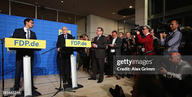 Philipp Roesler , Chairman of the German Free Democrats political party, and FDP lead candidate Rainer Bruederle speak to the media the day after the...