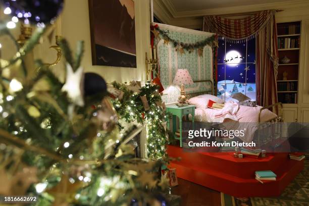 The White House Library is decorated to honor the tradition and magic of bedtime stories during a media preview of the 2023 holiday decorations on...