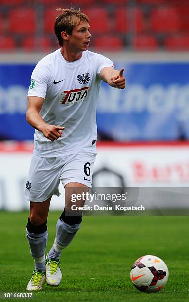 Kevin Schoeneberg of Muenster runs with the ball during the third Bundesliga match between 1. FC Heidenheim and Preussen Muenster at Voith-Arena on...