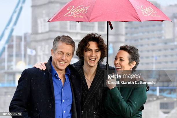 Hugh Grant, Timothée Chalamet and Olivia Colman attend the "Wonka" Photocall at Potters Field on November 27, 2023 in London, England.
