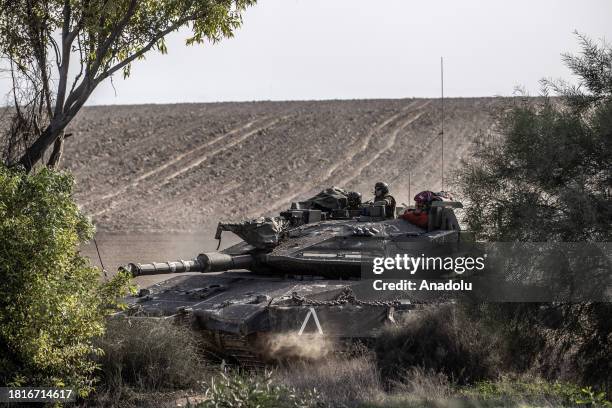 Israeli tanks, howitzers and armored vehicles are seen as Israeli Forces resume deploy soldiers, tanks and armored vehicles near the Gaza border in...