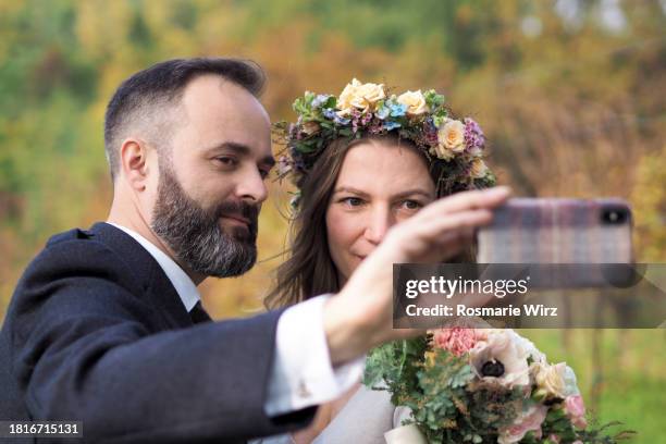 couple on wedding day making selfie - ambivere stock pictures, royalty-free photos & images