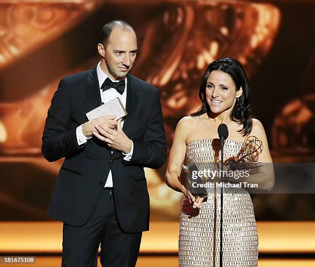 Winner of Best Supporting Actor in a Comedy Series Tony Hale and winner of Best Lead Actress in a Comedy Series, Julia Louis-Dreyfus speak onstage...