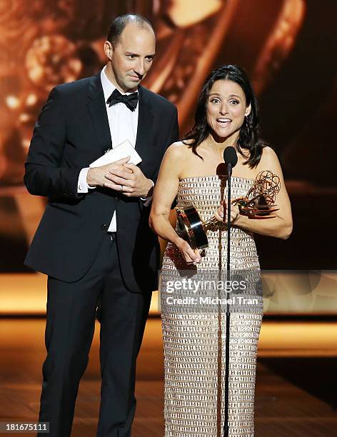 Winner of Best Supporting Actor in a Comedy Series Tony Hale and winner of Best Lead Actress in a Comedy Series, Julia Louis-Dreyfus speak onstage...