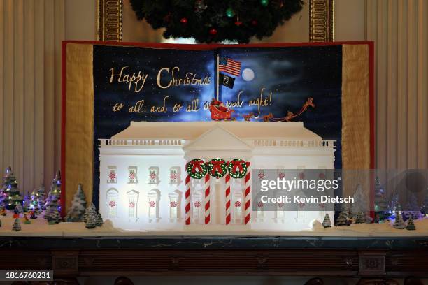 Gingerbread White House is displayed in the State Dining Room during a media preview of the 2023 holiday decorations at the White House November 27,...