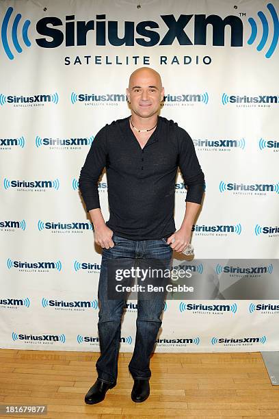 Former professional tennis player Andre Agassi poses at SiriusXM Studios on September 23, 2013 in New York City.