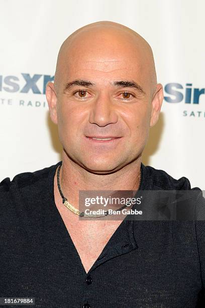 Former professional tennis player Andre Agassi poses at SiriusXM Studios on September 23, 2013 in New York City.