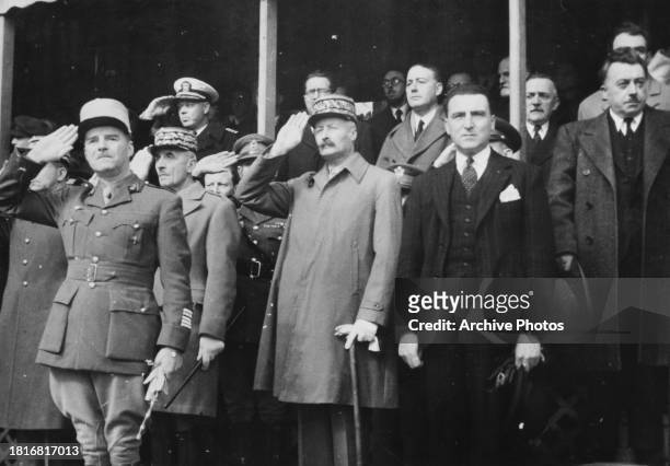 French military officer Henri Giraud and French military officer Georges Catroux watch the parade commemorating the Red Army's 26th Anniversary, in...