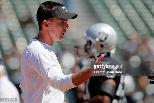 Head coach Dennis Allen of the Oakland Raiders encourages his team before a game against the Jacksonville Jaguars on September 15, 2013 at O.co...