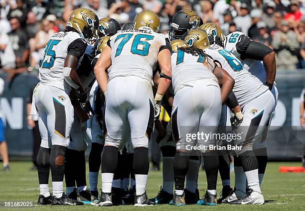 The Jacksonville Jaguars huddle during the second quarter against the Oakland Raiders against on September 15, 2013 at O.co Coliseum in Oakland,...