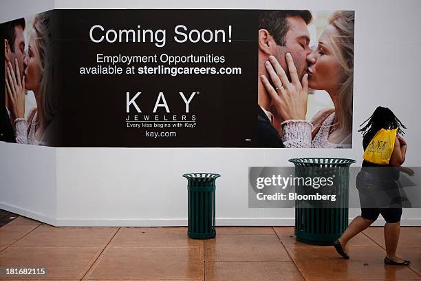 Shopper walks past the future location of a KAY Jewelers Inc. Store at Easton Town Center in Columbus, Ohio, U.S., on Friday, Sept. 20, 2013. The...