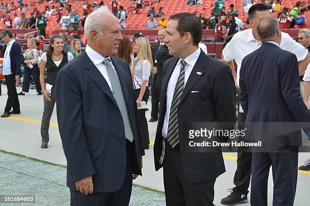 Owner Jeffrey Lurie of the Philadelphia Eagles and general manager Howie Roseman talk before the game at FedEx Field on September 9, 2013 in...