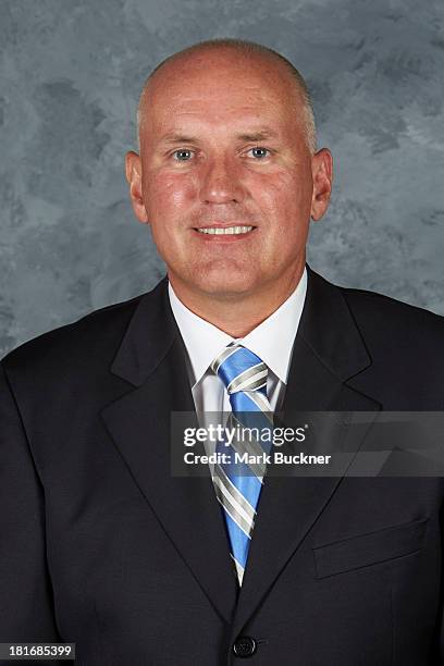 General Manager Doug Armstrong of the St. Louis Blues poses for his official headshot for the 2013-2014 season on September 12, 2013 at the Scottrade...