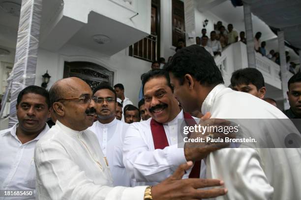 Sri Lankan President Mahinda Rajapaksa greets officials and friends as he works the crowd at the opening of the Sumanadasa Abeygunaward Astrological...