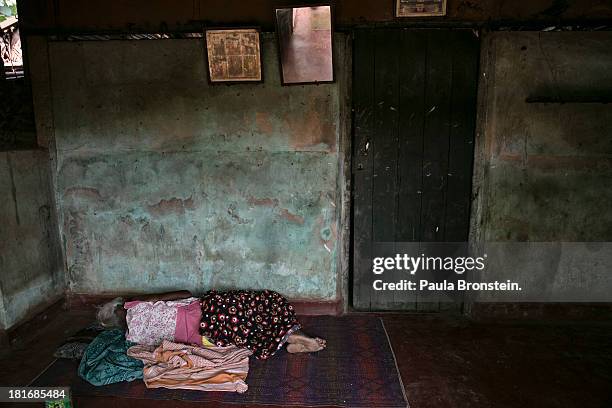 Woman sleeps in a camp for displaced Tamil families outside Jaffna, Sri Lanka, July 8, 2013. War's end has unleashed Sinhalese nationalism that has...