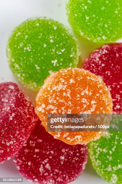 close-up of colorful candies on white background - jelly sweet stock pictures, royalty-free photos & images