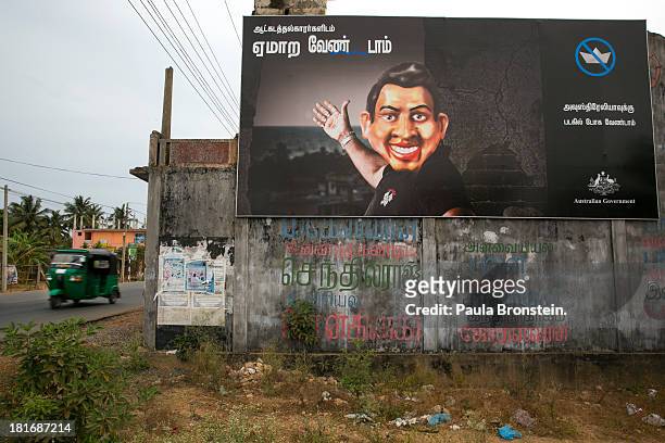 Large billboard by the Australian government is seen discouraging Tamils to come to their shores outside Jaffna, Sri Lanka July 9, 2013. War's end...