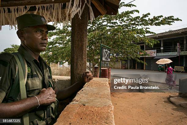 Sri Lankan military stand guard at a junction outside of Jaffna, Sri Lanka, July 9, 2013. War's end has unleashed Sinhalese nationalism that has...