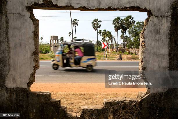 Three wheeler vehicle drives along the highway outside Jaffna, Sri Lanka, July 9, 2013. War's end has unleashed Sinhalese nationalism that has Tamils...