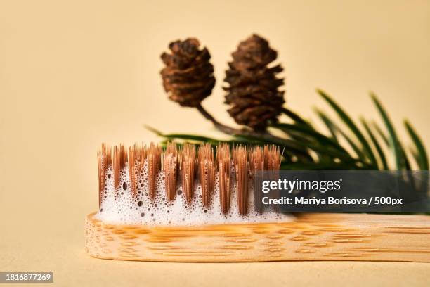 close-up of brush on table against black background - dentifrice stockfoto's en -beelden