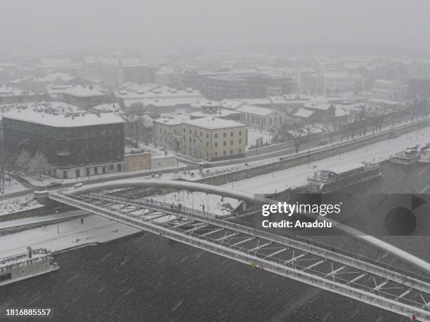An aerial view of a snow covered bridge during a snow storm in Krakow, Poland on December 02, 2023. According to the Polish Institute of Meteorology,...