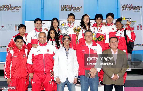 Belen Costa Ortega of Peru, poses with her team and gold medal after winning the 63 kg of Taekwondo as part of the I ODESUR South American Youth...