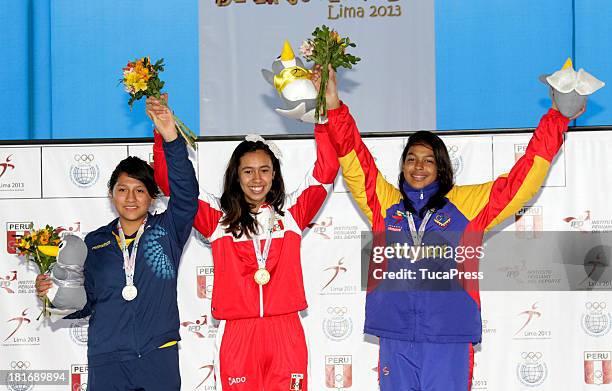 Belen Costa Ortega of Peru, poses with her team and gold medal after winning the 63 kg of Taekwondo as part of the I ODESUR South American Youth...