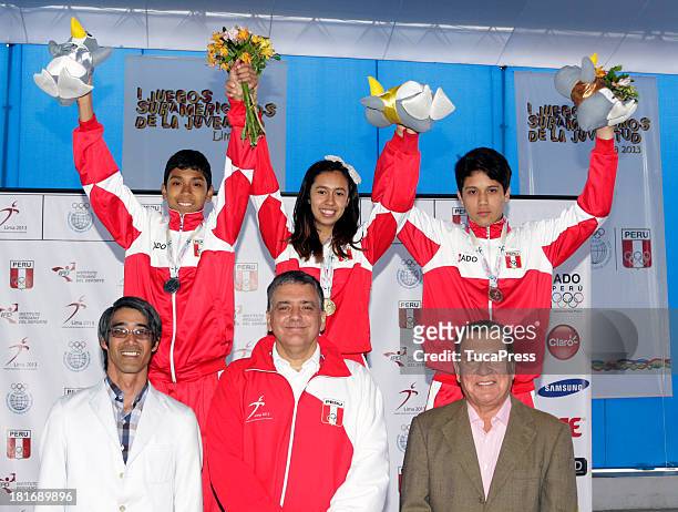Belen Costa Ortega of Peru, poses with her team and gold medal after winning the 63 kg of Taekwondo as part of the I ODESUR South American Youth...