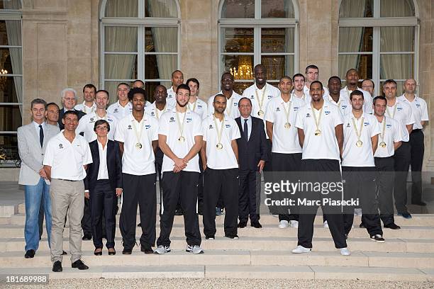 The French basketball team poses with French President Francois Hollande at the Elysee presidential palace on September 23, 2013 in Paris, France....