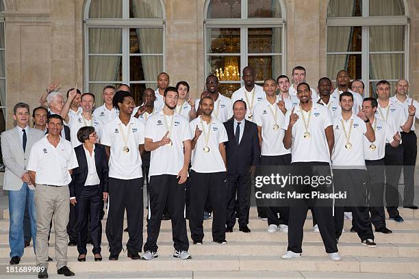 The French basketball team poses with French President Francois Hollande at the Elysee presidential palace on September 23, 2013 in Paris, France....