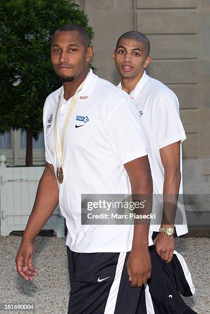 French basketball players Boris Diaw and Nicolas Batum enter the Elysee presidential palace on September 23, 2013 in Paris, France. France won the...