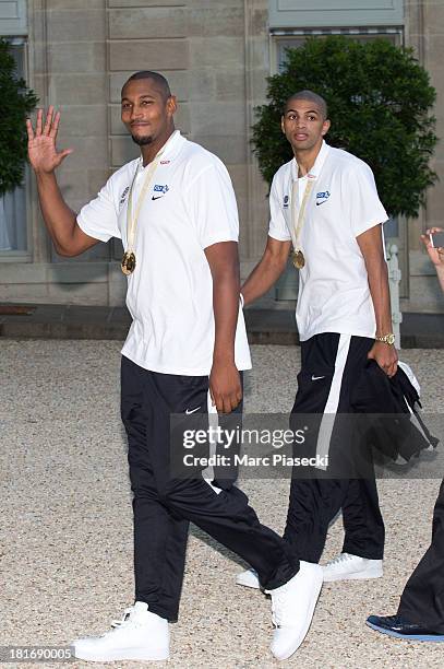 French basketball players Boris Diaw and Nicolas Batum enter the Elysee presidential palace on September 23, 2013 in Paris, France. France won the...