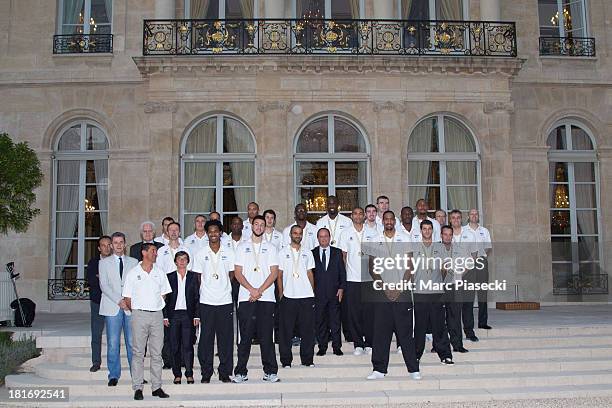 French basketball player Tony Parker poses with French President Francois Hollande at the Elysee presidential palace on September 23, 2013 in Paris,...