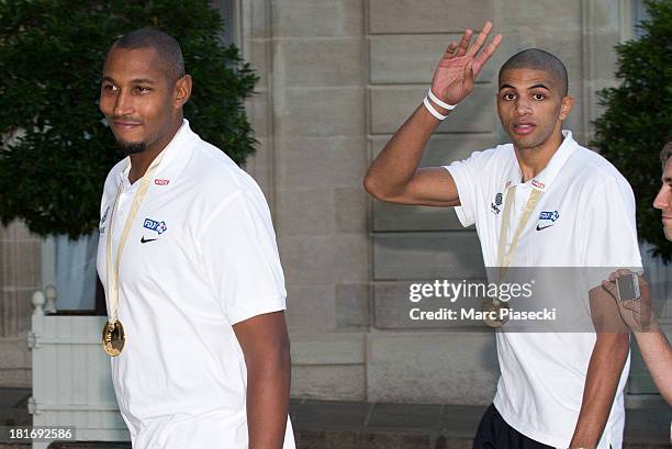 French basketball players Boris Diaw and Nicolas Batum enter the Elysee presidential palace on September 23, 2013 in Paris, France. France won the...