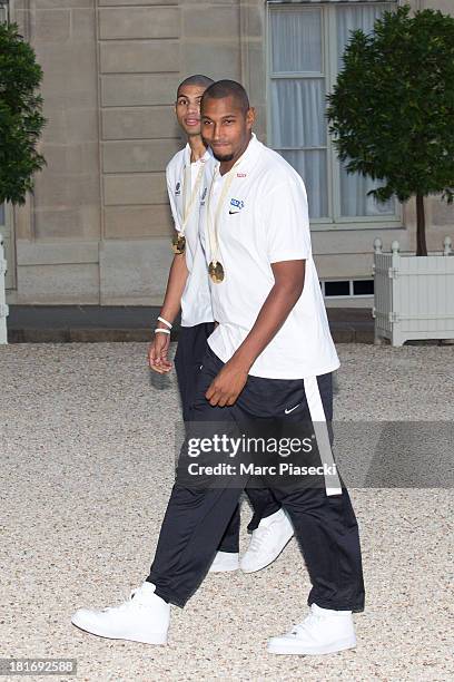 French basketball players Boris Diaw and Nicolas Batum enter the Elysee presidential palace on September 23, 2013 in Paris, France. France won the...
